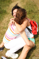 Lesbians-exploring-each-other's-pussies-outdoors