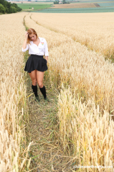 Schoolgirl-pleasuring-herself-in-a-wheat-field