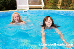 Lizzy-and-Nikita-having-fun-in-a-swimming-pool