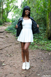 Brunette-beauty-relaxes-in-forest-clearing