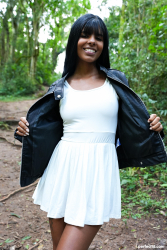 Brunette-beauty-relaxes-in-forest-clearing