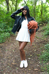Brunette-beauty-relaxes-in-forest-clearing