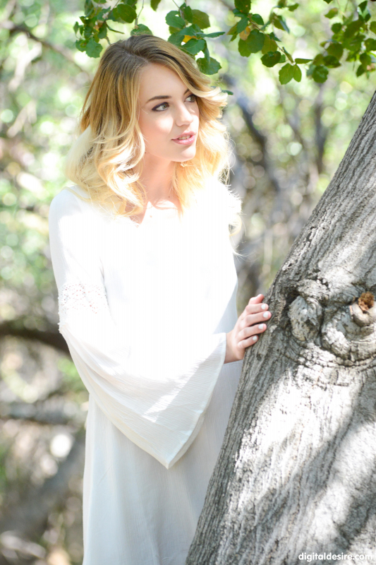 Blonde angel touches herself in the forest
