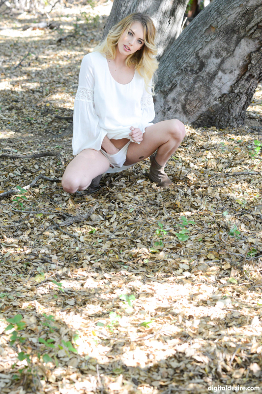 Blonde angel touches herself in the forest
