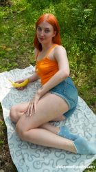 Redhead-Emma-rubs-in-nature